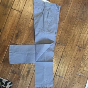 Grey pinstriped dress pants.